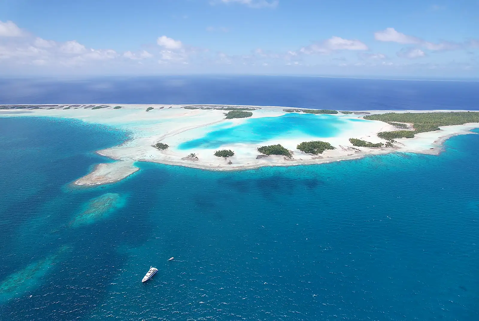 Yacht anchored off a remote atoll — reliable communications wherever the water takes you